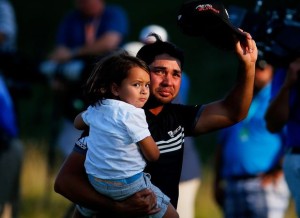 SHEBOYGAN, WI - AUGUST 16: Jason Day of Australia walks off the 18th green with his son Dash after winning the 2015 PGA Championship with a score of 20-under par at Whistling Straits on August 16, 2015 in Sheboygan, Wisconsin.   Kevin C. Cox, Image: 255756839, License: Rights-managed, Restrictions: , Model Release: no, Credit line: Profimedia, AFP